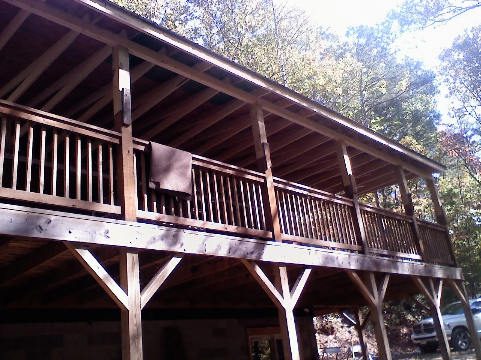 Timber framing under a new elevated porch and deck — Roof Leak Repair in West Mansfield by Roofing Brothers